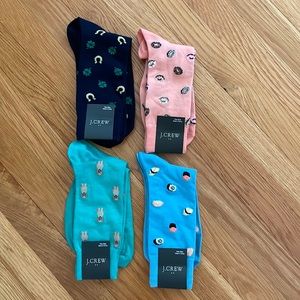 4 prs Men’s J Crew dress socks: Donuts, sushi, dogs, clovers. Tags on. One size.